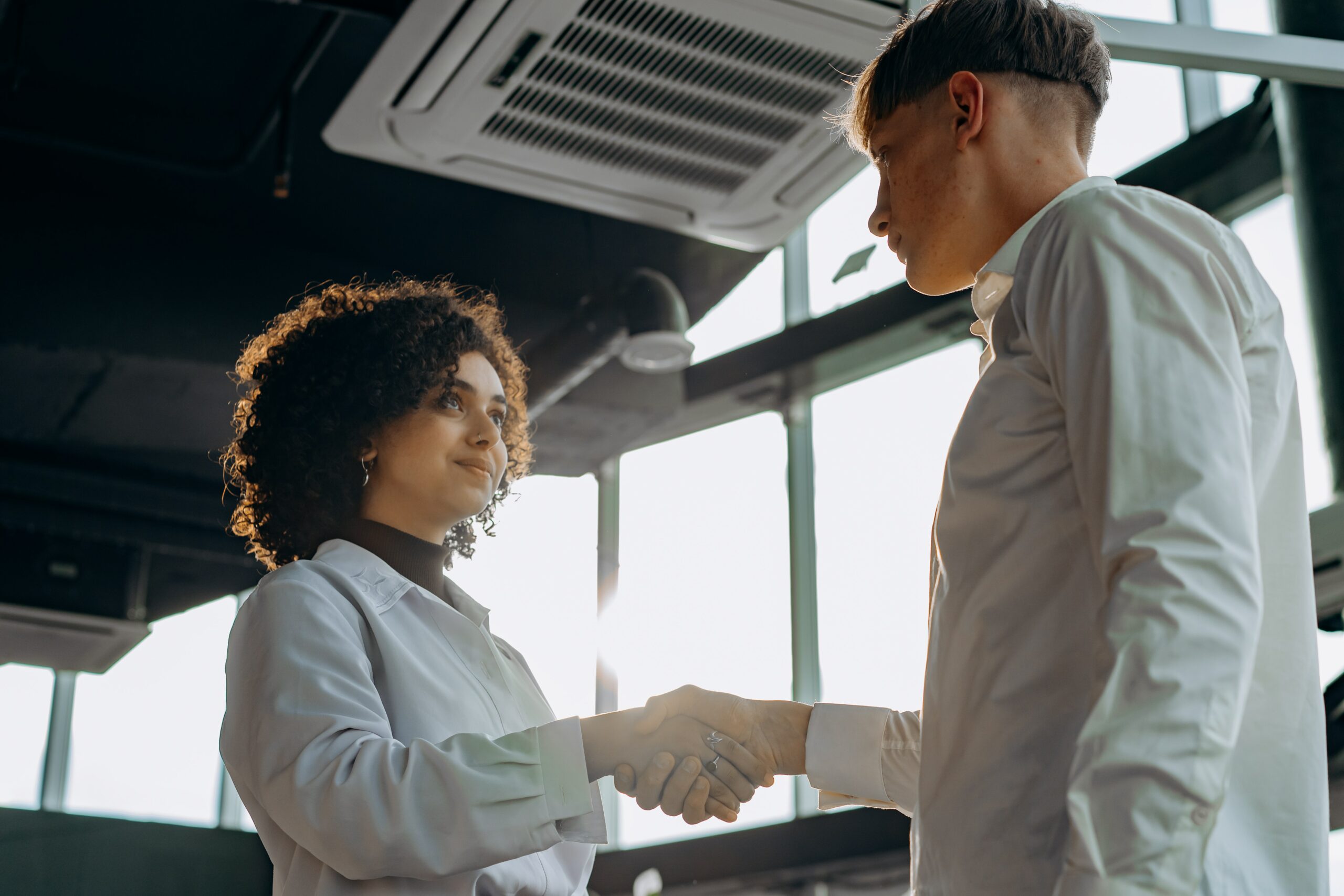 Finesse Group - Man and woman shaking hands